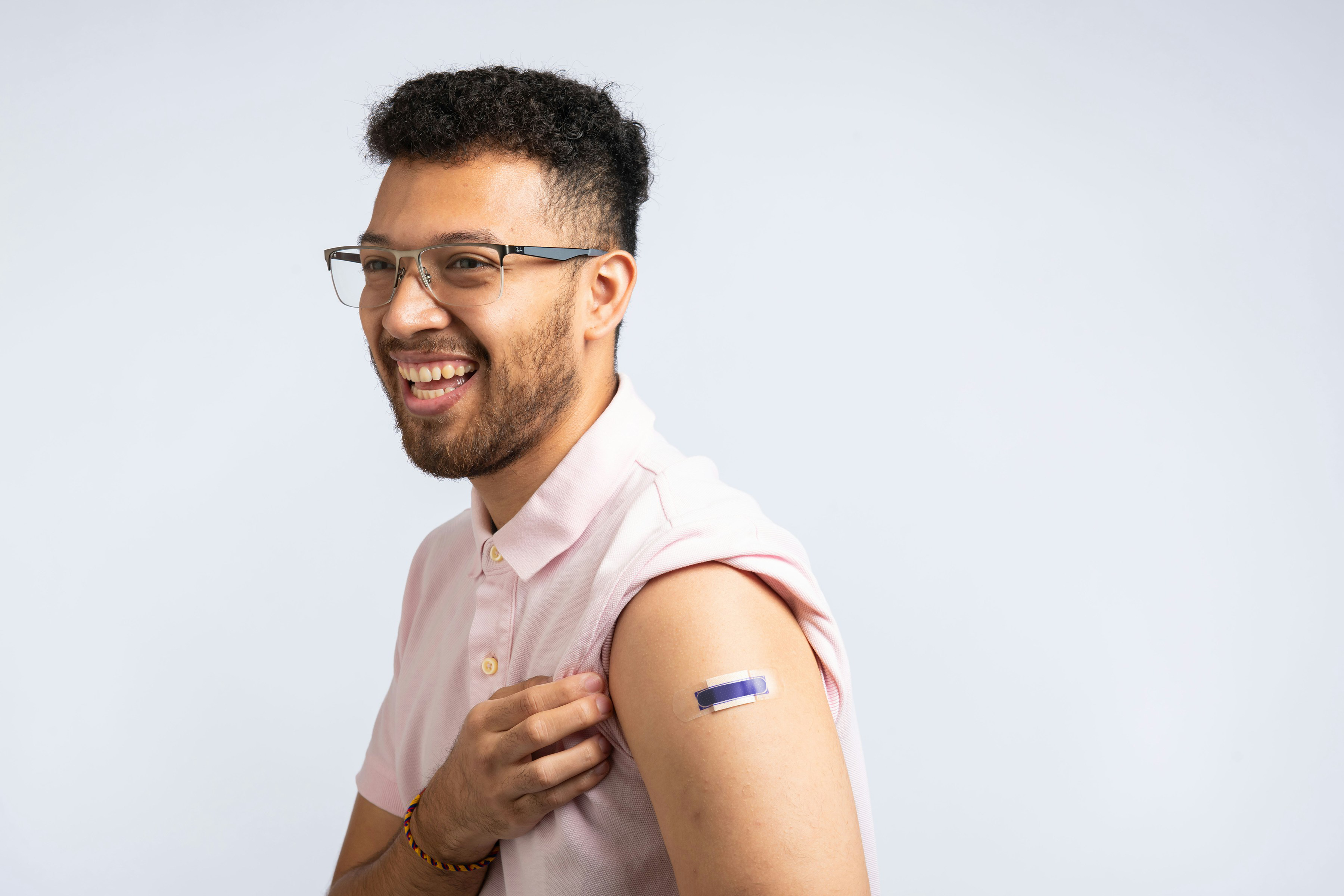 Man with bandaid on arm.